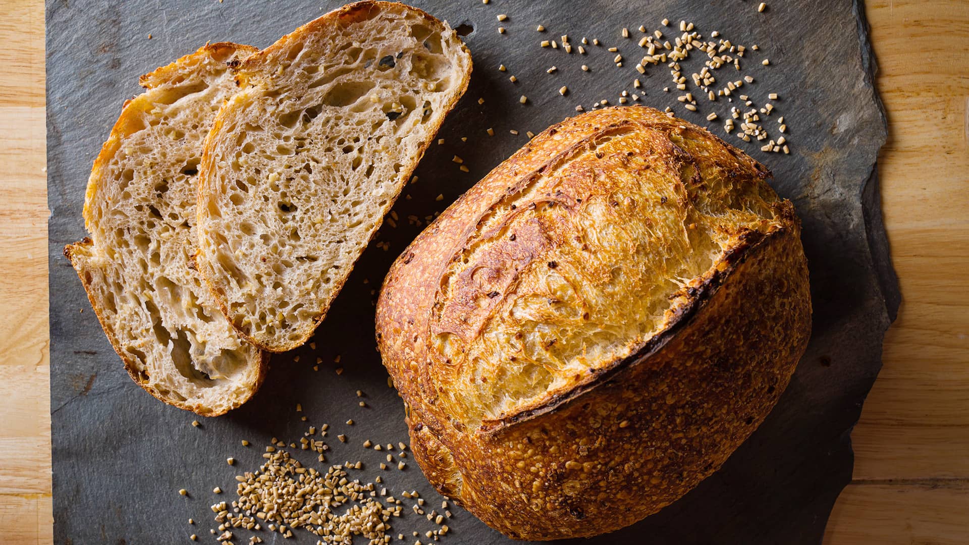 Warm workshop-style bakery image with loaves and soft light
